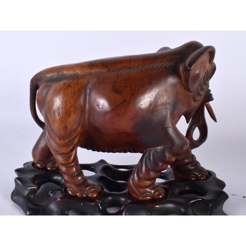 395 - THREE 19TH CENTURY CHINESE CARVED HARDWOOD WOOLLY MAMMOTH ELEPHANTS Qing. Largest 27 cm x 22cm. (3)