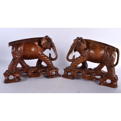 395 - THREE 19TH CENTURY CHINESE CARVED HARDWOOD WOOLLY MAMMOTH ELEPHANTS Qing. Largest 27 cm x 22cm. (3)