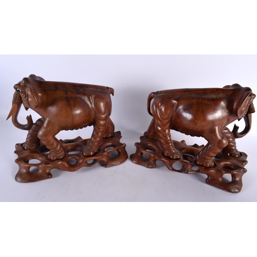 395 - THREE 19TH CENTURY CHINESE CARVED HARDWOOD WOOLLY MAMMOTH ELEPHANTS Qing. Largest 27 cm x 22cm. (3)