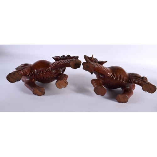 395 - THREE 19TH CENTURY CHINESE CARVED HARDWOOD WOOLLY MAMMOTH ELEPHANTS Qing. Largest 27 cm x 22cm. (3)