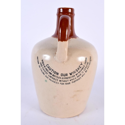 40 - AN IRISH JOHN LOCKES KILBEGGAN WHISKEY JUG together with two Hungarian wine bottles. Largest 22cm hi... 