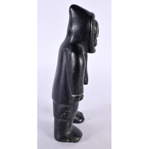 404 - A CHARMING NORTH AMERICAN INUIT CARVED STONE FIGURE OF AN ESKIMO. 16 cm high.