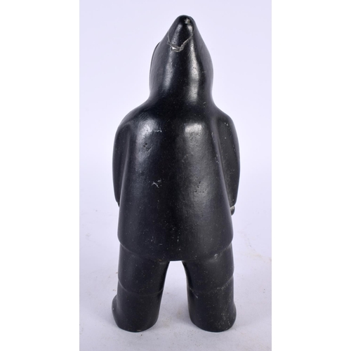 404 - A CHARMING NORTH AMERICAN INUIT CARVED STONE FIGURE OF AN ESKIMO. 16 cm high.