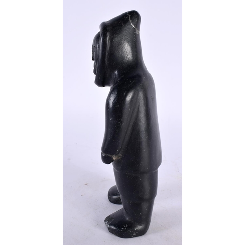 404 - A CHARMING NORTH AMERICAN INUIT CARVED STONE FIGURE OF AN ESKIMO. 16 cm high.