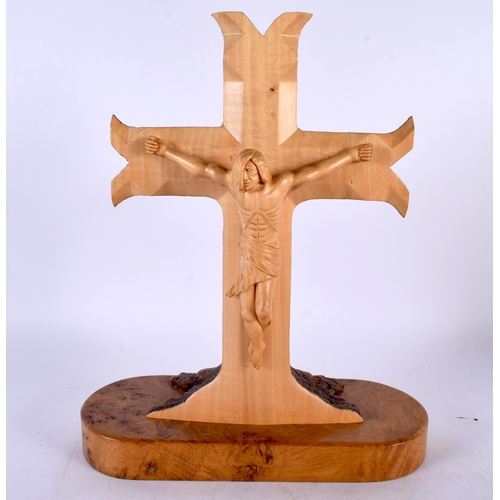 409 - AN UNUSUAL CONTEMPORARY CARVED BURR WALNUT CRUCIFIX signed and numbered. 30cm x 22cm.