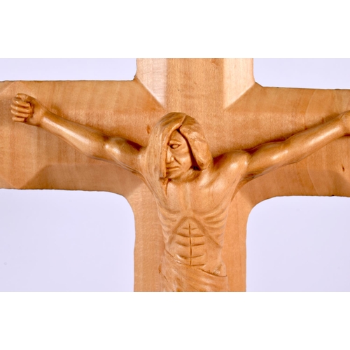 409 - AN UNUSUAL CONTEMPORARY CARVED BURR WALNUT CRUCIFIX signed and numbered. 30cm x 22cm.