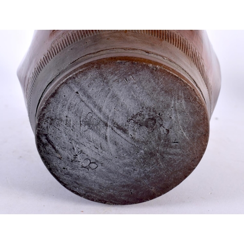 411 - AN ANTIQUE MIDDLE EASTERN WRYTHEN MOULDED POTTERY VASE with faint incised decoration. 23 cm high.