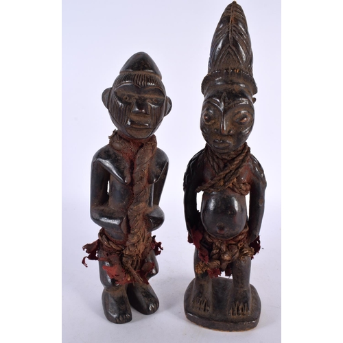 412 - TWO AFRICAN TRIBAL CARVED WOOD FIGURES. Largest 28cm high. (2)