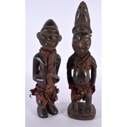 412 - TWO AFRICAN TRIBAL CARVED WOOD FIGURES. Largest 28cm high. (2)