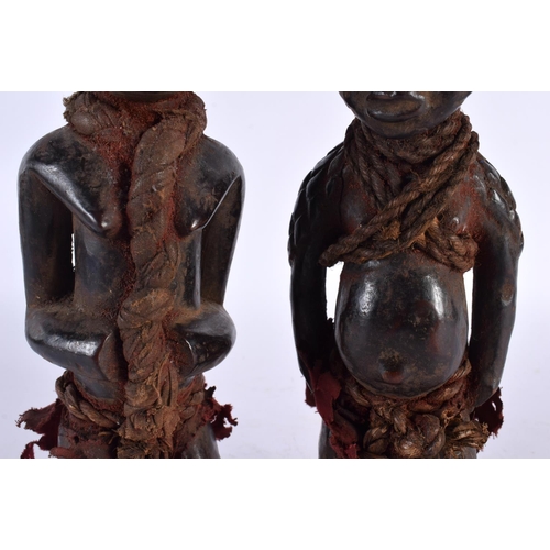 412 - TWO AFRICAN TRIBAL CARVED WOOD FIGURES. Largest 28cm high. (2)