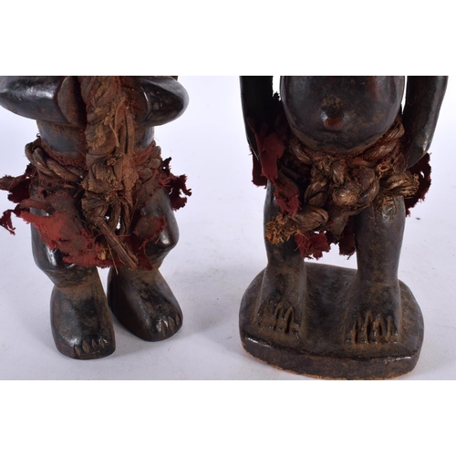 412 - TWO AFRICAN TRIBAL CARVED WOOD FIGURES. Largest 28cm high. (2)