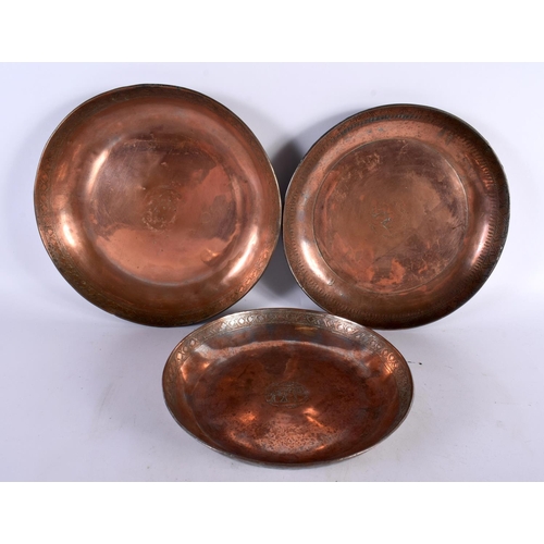 414 - THREE EARLY MIDDLE EASTERN TINNED COPPER ALLOY DISHES in various forms and sizes. Largest 26 cm diam... 