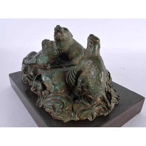 419 - A CHARMING ART DECO GREEN VERDIGRIS BRONZE FIGURE OF SEA LIONS modelled upon crashing waves and a ma... 