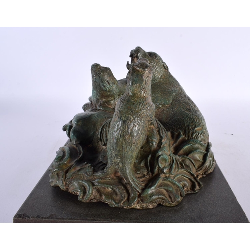 419 - A CHARMING ART DECO GREEN VERDIGRIS BRONZE FIGURE OF SEA LIONS modelled upon crashing waves and a ma... 