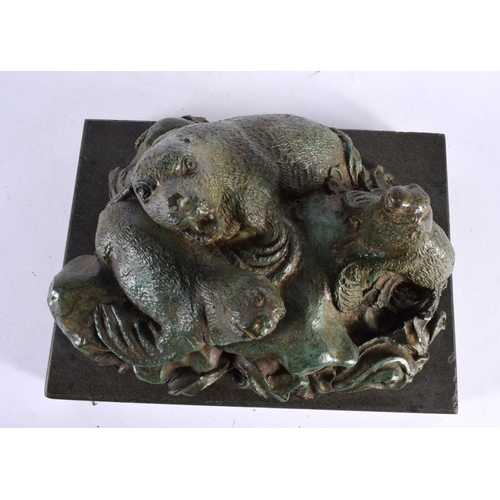 419 - A CHARMING ART DECO GREEN VERDIGRIS BRONZE FIGURE OF SEA LIONS modelled upon crashing waves and a ma... 