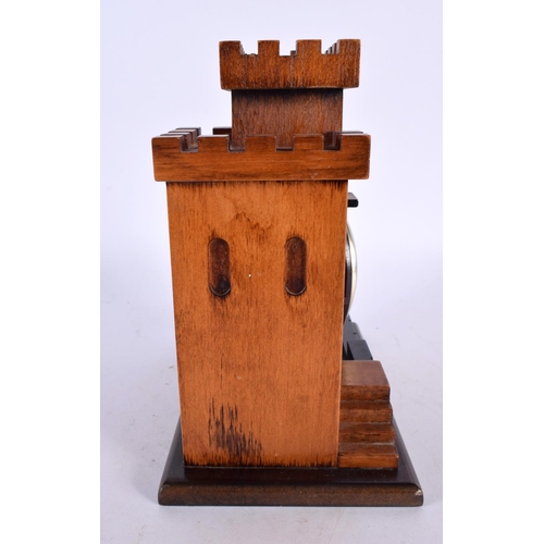 420 - A CHARMING TREEN CARVED WOOD ARCHITECTURAL DESK CLOCK formed as a castle turret. 18cm x 15cm.