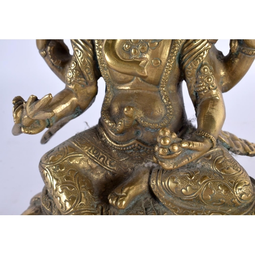 425 - A 19TH CENTURY INDIAN MIDDLE EASTERN BRONZE FIGURE OF GANESHA modelled upon a triangular lotus base.... 