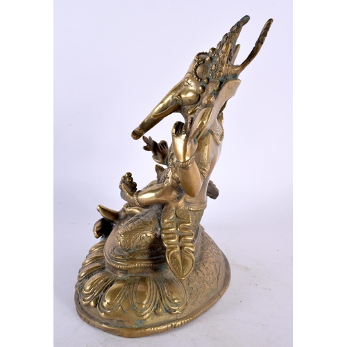 425 - A 19TH CENTURY INDIAN MIDDLE EASTERN BRONZE FIGURE OF GANESHA modelled upon a triangular lotus base.... 