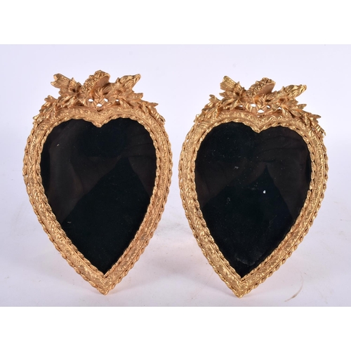 429 - A PAIR OF CONTEMPORARY ORMOLU HEART SHAPED PHOTOGRAPH FRAMES. 18cm x 13 cm.