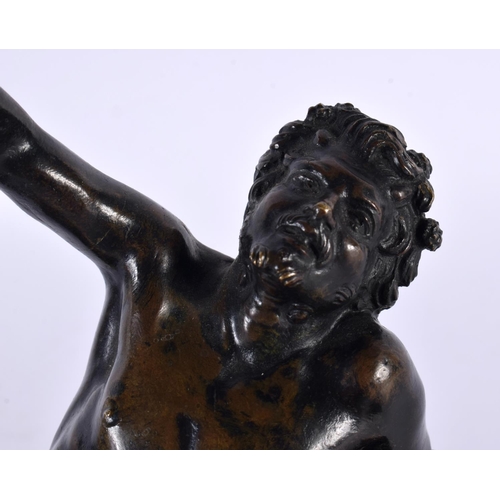 434 - A 19TH CENTURY ITALIAN GRAND TOUR BRONZE FIGURE OF A DRUNKEN MALE modelled reclining upon a naturali... 