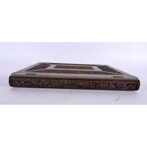 438 - A LARGE 19TH CENTURY ANGLO INDIAN CARVED SANDALWOOD BOOK COVER carved with animals within landscapes... 