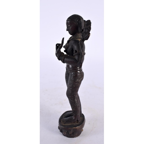 442 - A 19TH CENTURY MIDDLE EASTERN INDIAN BRONZE FIGURE OF A FEMALE DEITY modelled with one hand raised. ... 