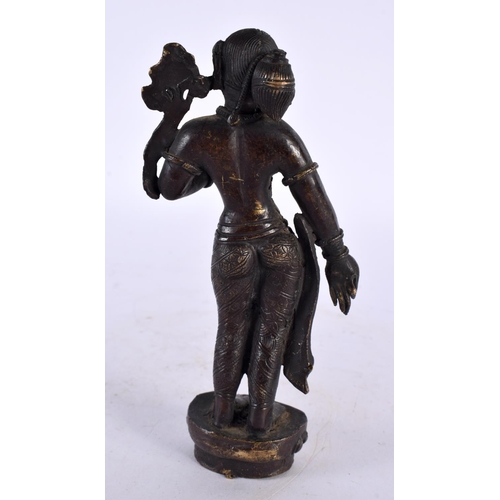 442 - A 19TH CENTURY MIDDLE EASTERN INDIAN BRONZE FIGURE OF A FEMALE DEITY modelled with one hand raised. ... 