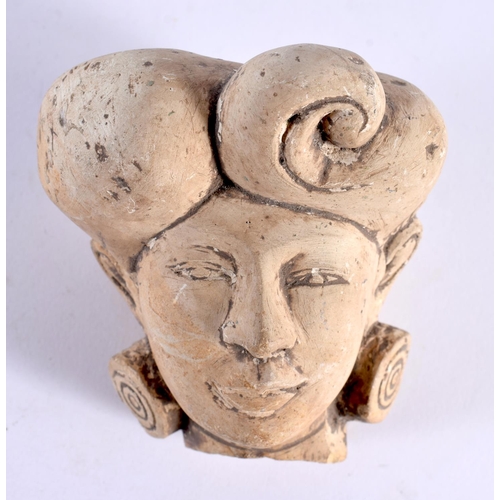 444 - AN EARLY MIDDLE EASTERN INDIAN STUCCO PORTRAIT BUST HEAD modelled with stylised earrings. 9 cm x 7cm... 