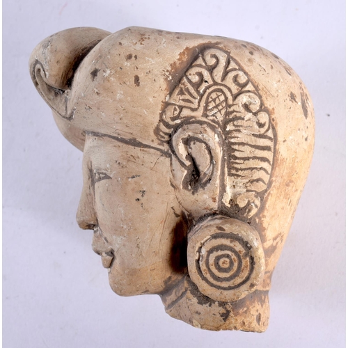 444 - AN EARLY MIDDLE EASTERN INDIAN STUCCO PORTRAIT BUST HEAD modelled with stylised earrings. 9 cm x 7cm... 