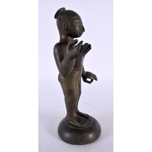 445 - A LOVELY 18TH CENTURY INDIAN BRONZE FIGURE OF A STANDING DEITY modelled nude with one hand raised. 2... 