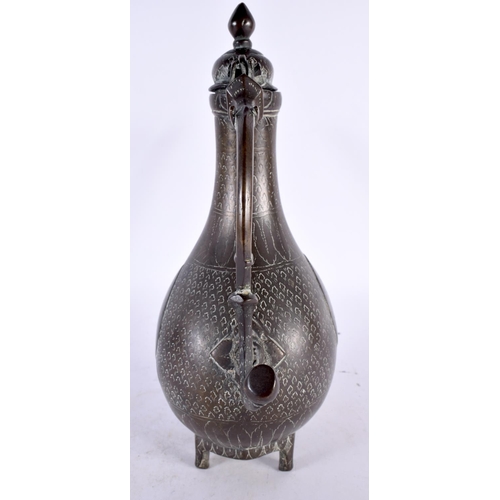 446 - A LARGE 18TH CENTURY MIDDLE EASTERN MUGHAL BRONZE EWER decorated all over with foliage, tear drop pa... 