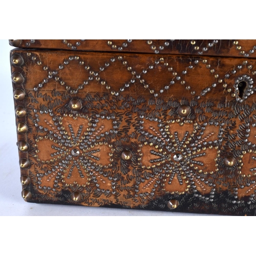 447 - A LOVELY 19TH CENTURY ARTS AND CRAFTS LEATHER WOOD AND STUD WORK CASKET decorated with Religious fig... 