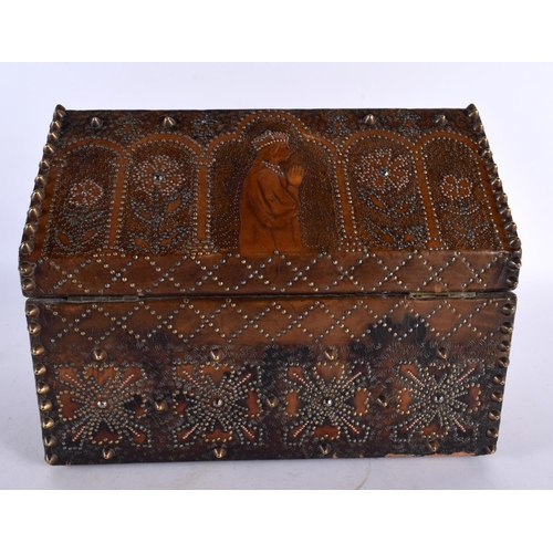 447 - A LOVELY 19TH CENTURY ARTS AND CRAFTS LEATHER WOOD AND STUD WORK CASKET decorated with Religious fig... 