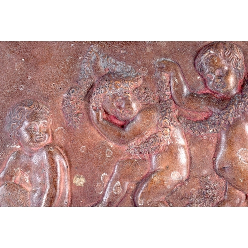 448 - A 19TH CENTURY EUROPEAN CARVED RECTANGULAR TERRACOTTA PANEL depicting four putti in various pursuits... 