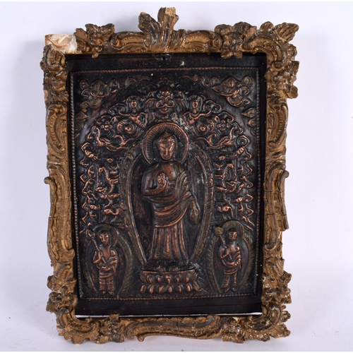 449 - A 19TH CENTURY MIDDLE EASTERN ASIAN REPOUSSE BUDDHISTIC PANEL depicting buddha's, encased within a g... 