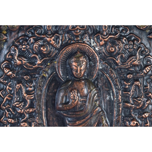 449 - A 19TH CENTURY MIDDLE EASTERN ASIAN REPOUSSE BUDDHISTIC PANEL depicting buddha's, encased within a g... 