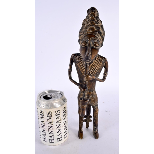 450 - A LARGE 19TH CENTURY AFRICAN TRIBAL BRONZE FIGURE OF A WOLF MUSICIAN modelled playing a pipe. 30cm h... 