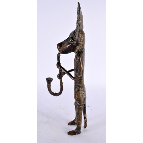 450 - A LARGE 19TH CENTURY AFRICAN TRIBAL BRONZE FIGURE OF A WOLF MUSICIAN modelled playing a pipe. 30cm h... 