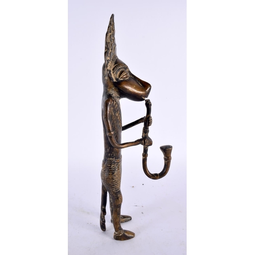 450 - A LARGE 19TH CENTURY AFRICAN TRIBAL BRONZE FIGURE OF A WOLF MUSICIAN modelled playing a pipe. 30cm h... 