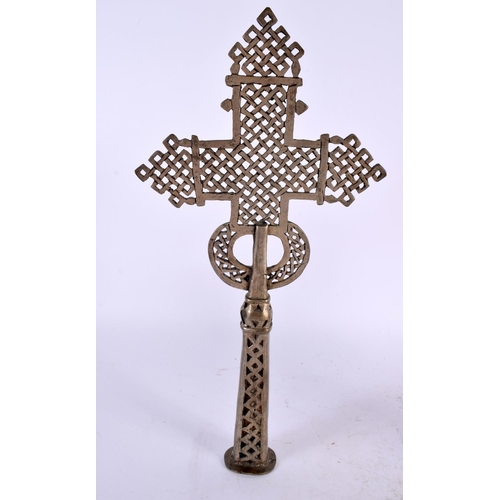 455 - AN AFRICAN ETHIOPIAN COPTIC BRONZE CROSS together with a tribal carved wood cup. Largest 32 cm high.... 