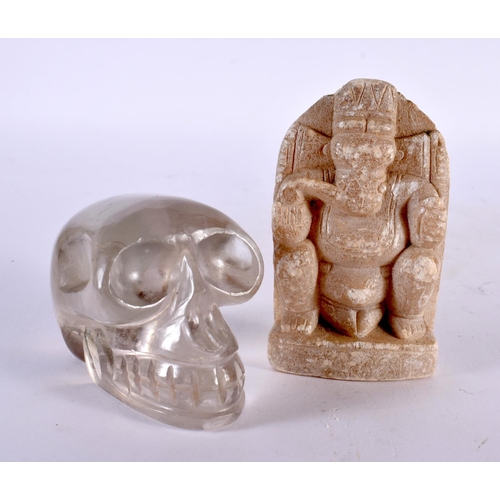 457 - A LATE 19TH CENTURY INDIAN CARVED STONE FIGURE OF GANESHA together with a carved rock crystal skull.... 