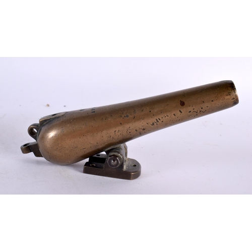 458 - TWO ANTIQUE BRONZE CANNONS together with a treen mortar. Largest 16 cm high. (3)