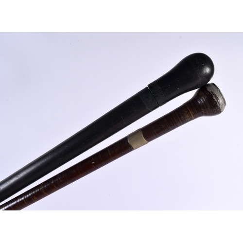 460 - A VINTAGE SWORD STICK together with another flexible leather wrapped stick. Largest 85 cm long. (2)