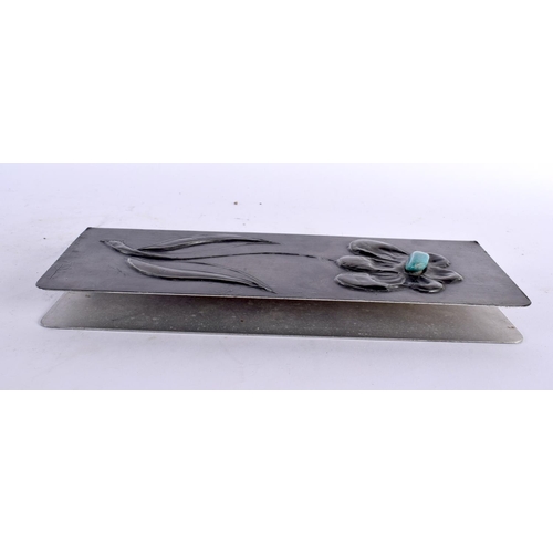 464 - A VINTAGE PEWTER AND TURQUOISE STONE BOOK COVER decorated with a flower. 28cm x 10 cm.