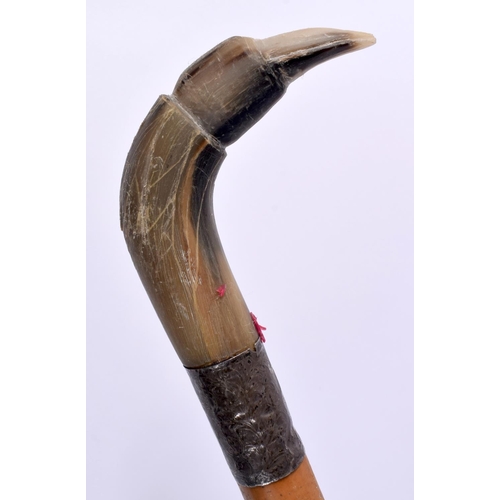 467 - A 19TH CENTURY MIDDLE EASTERN CARVED RHINOCEROS HORN CANE together with another horn handled cane. 9... 