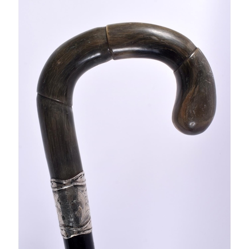 468 - A 19TH CENTURY MIDDLE EASTERN RHINOCEROS HORN CANE together with two others. 90cm long. (3)