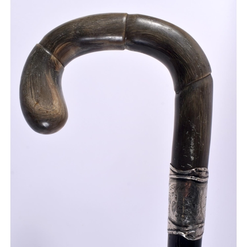 468 - A 19TH CENTURY MIDDLE EASTERN RHINOCEROS HORN CANE together with two others. 90cm long. (3)