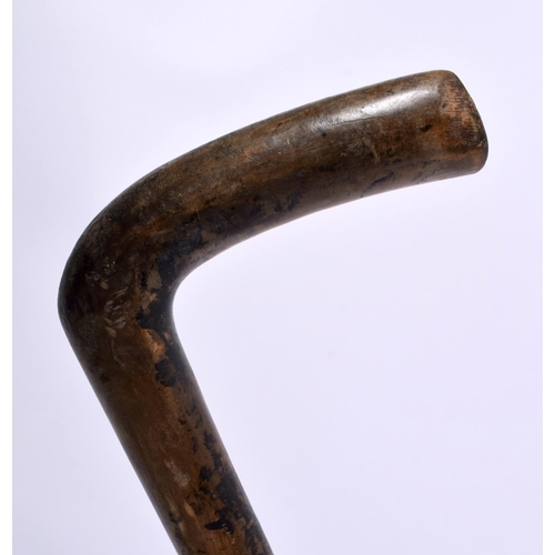 468 - A 19TH CENTURY MIDDLE EASTERN RHINOCEROS HORN CANE together with two others. 90cm long. (3)