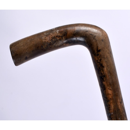 468 - A 19TH CENTURY MIDDLE EASTERN RHINOCEROS HORN CANE together with two others. 90cm long. (3)