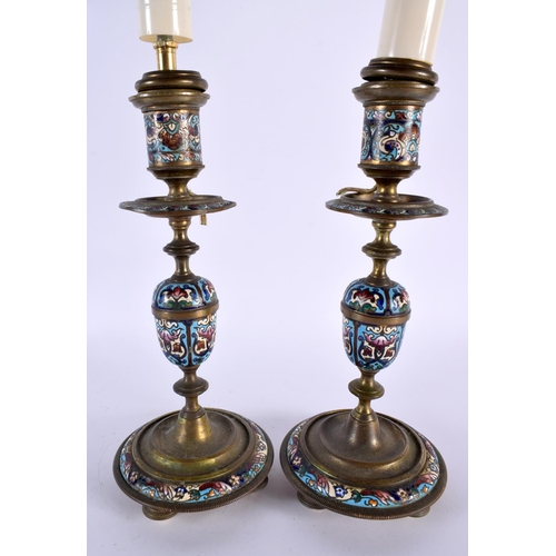 470 - A PAIR OF 19TH CENTURY FRENCH CHAMPLEVE ENAMEL BRONZE CANDLESTICKS decorated with flowers. 42 cm hig... 